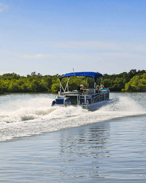 People enjoying a day out in a pontoon boat.