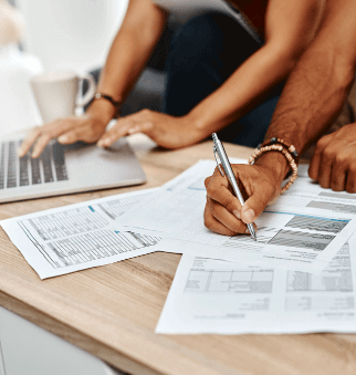 A couple going over their finances together at home.