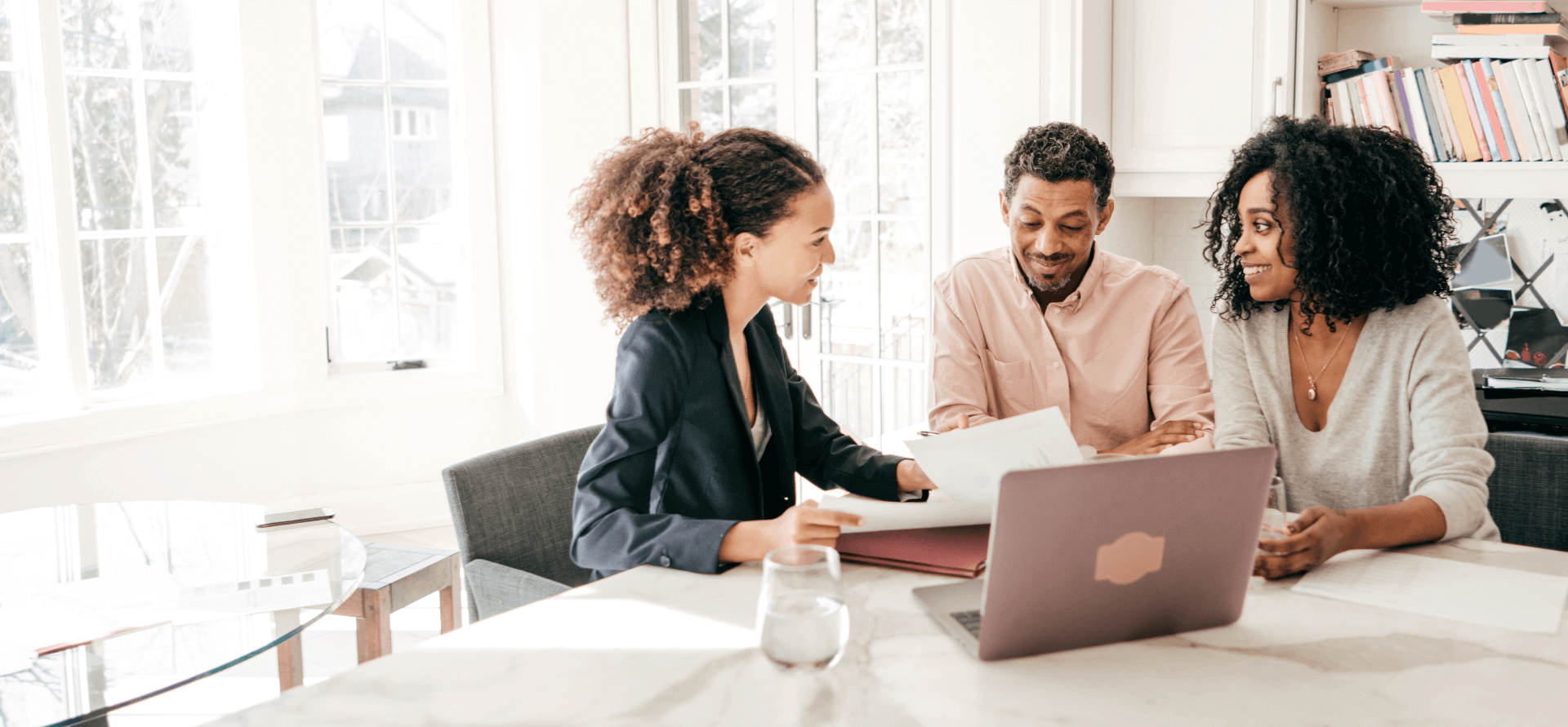 Couple speaking to their contractor.