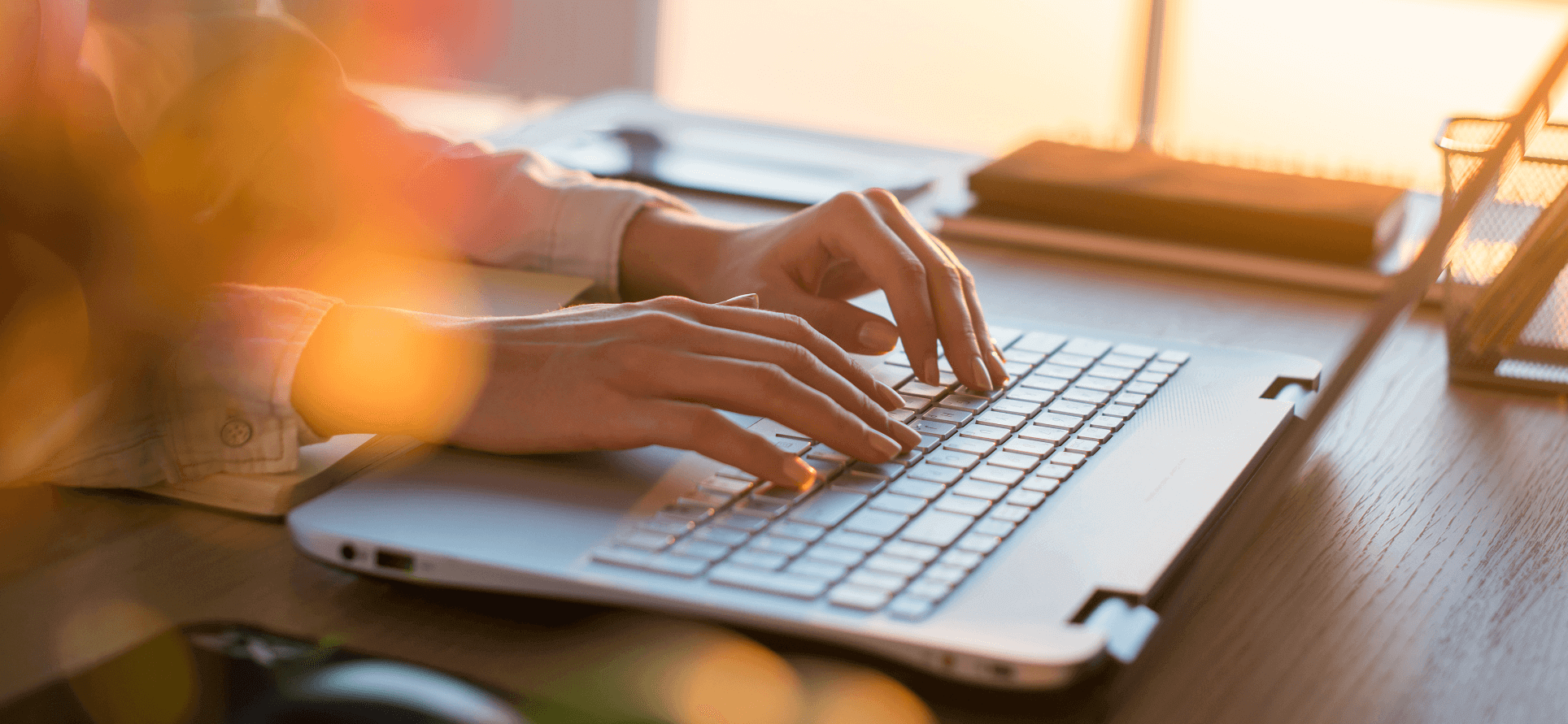 Person typing on a laptop.